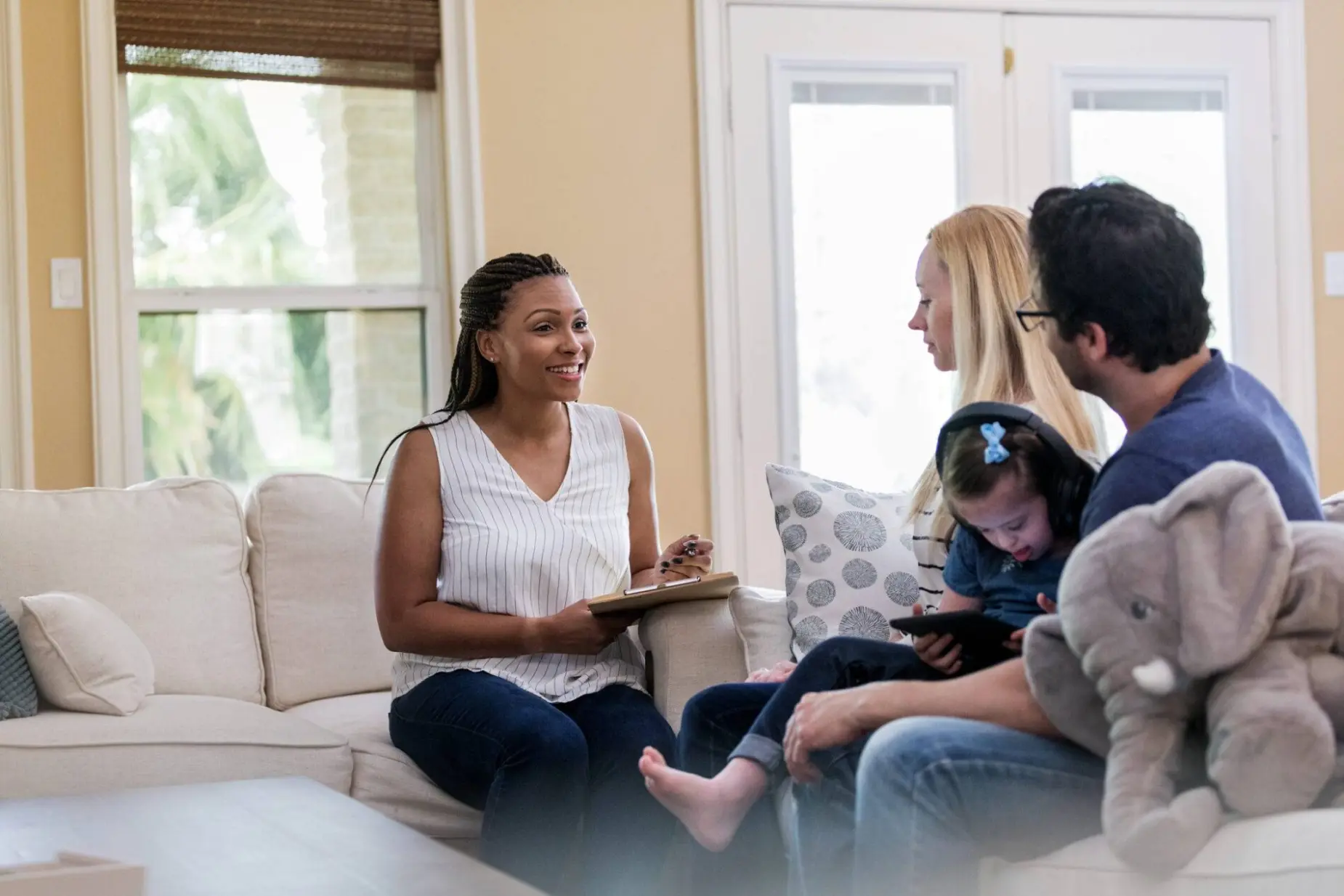 Medical social worker meeting with a family at home